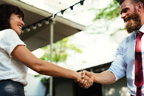 Photo of a men and women shaking hands -HR Managers Interview